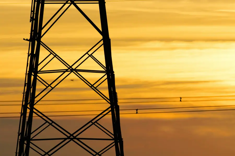 Power transmission tower at sunset
